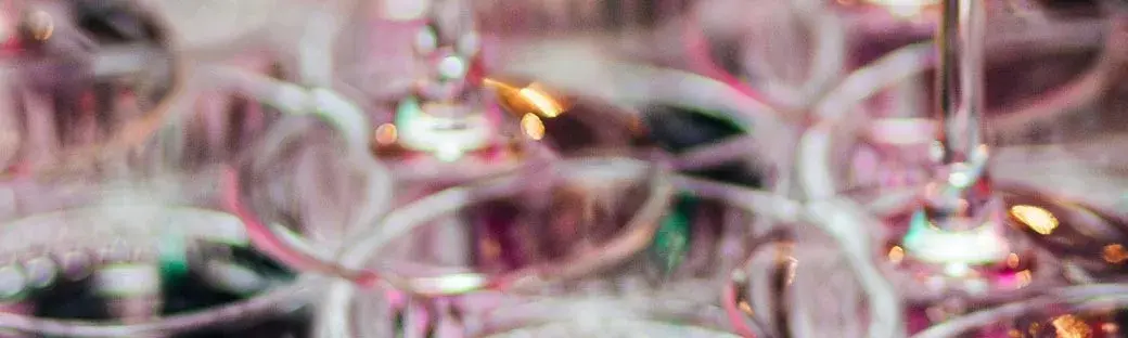 Glassware catching the light at a Victoria Foundation event